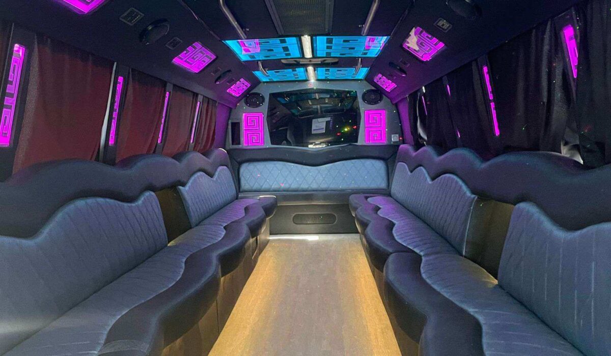 Spacious prom limo interior with neon lights and leather seating, providing a stylish and secure ride.